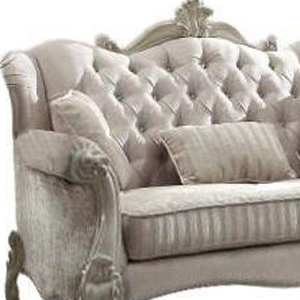 70" Bone And Gold Faux Leather Curved Loveseat