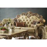 70" Bone And Gold Faux Leather Curved Loveseat