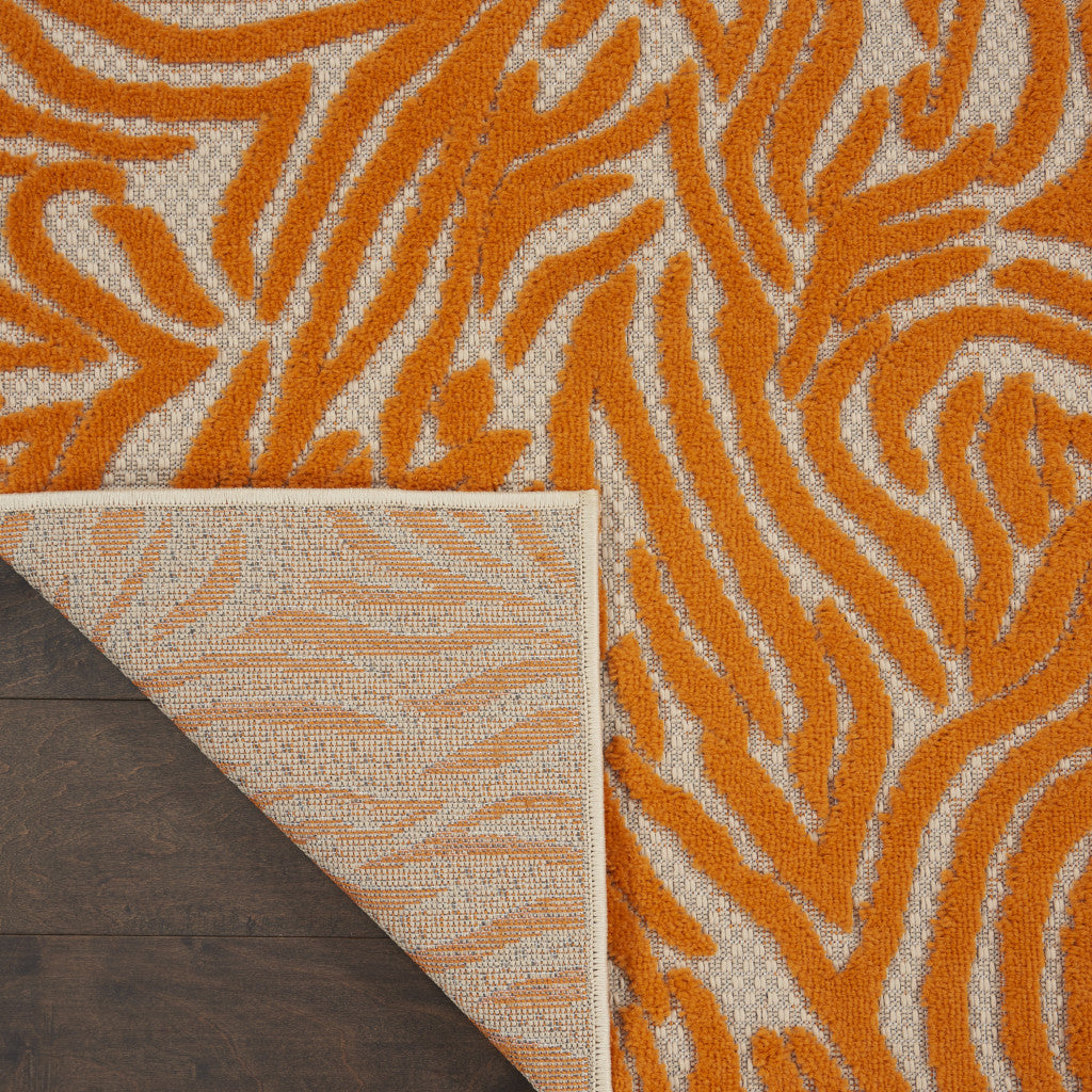 4' X 6' Orange And Ivory Abstract Stain Resistant Indoor Outdoor Area Rug