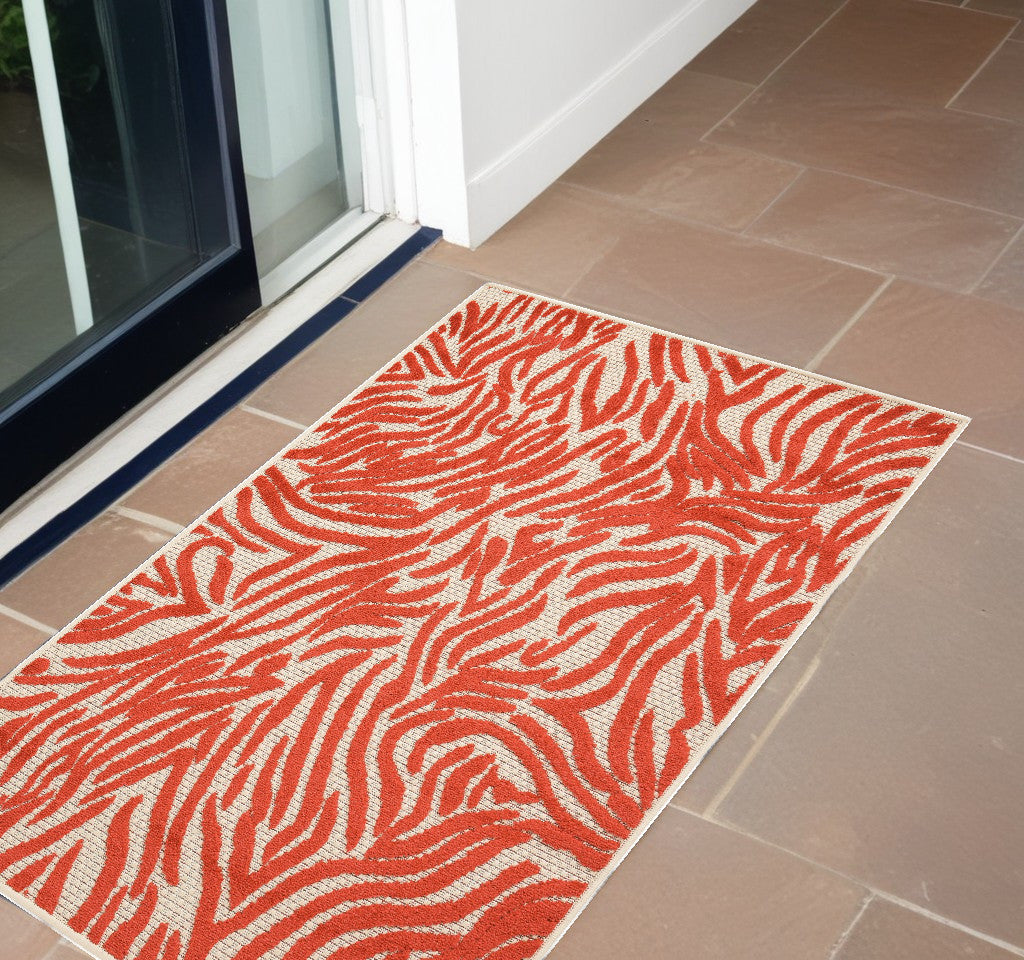 4' X 6' Orange And Ivory Abstract Stain Resistant Indoor Outdoor Area Rug