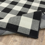 2' X 8' Black and Ivory Indoor Outdoor Area Rug