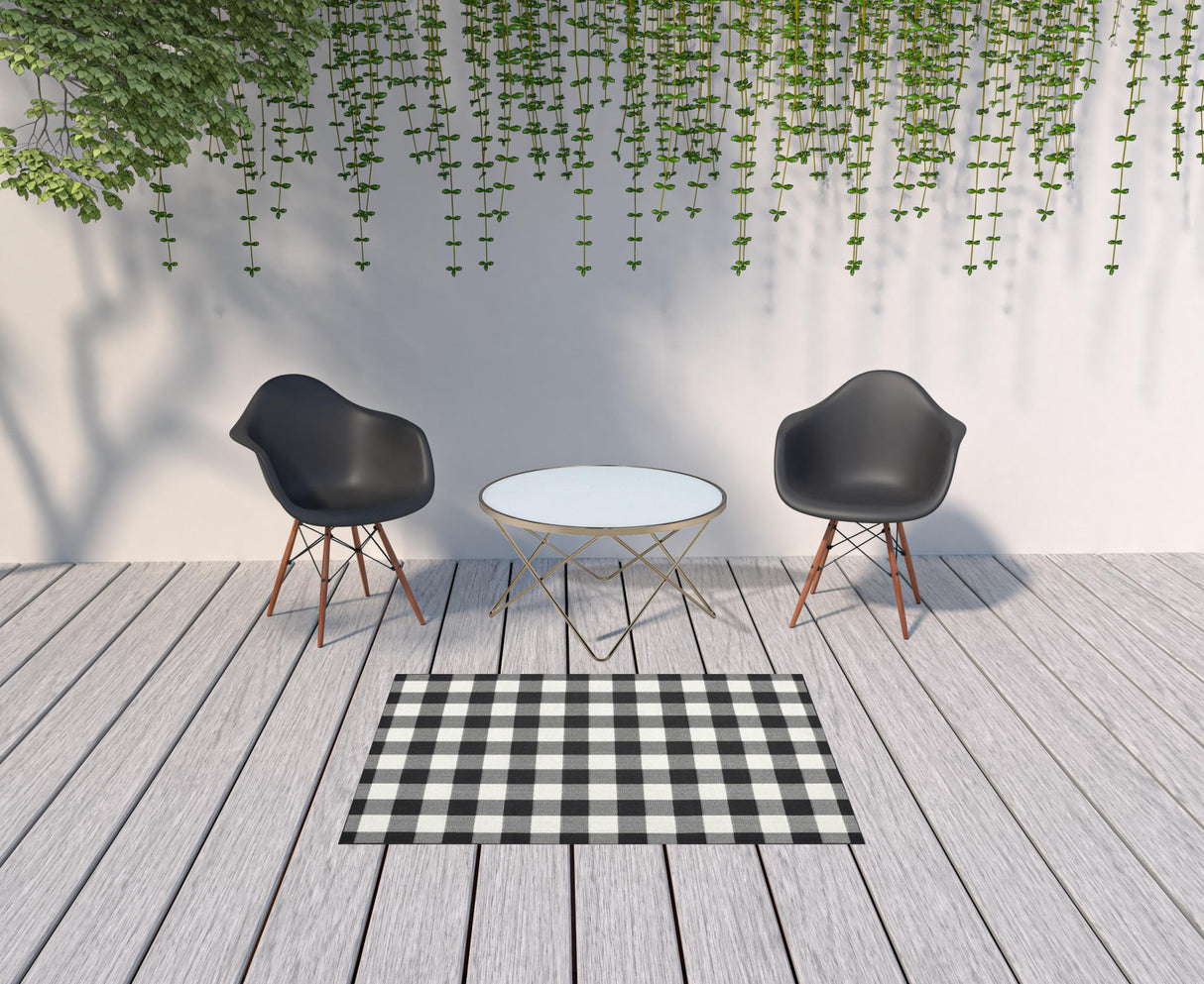 2' X 8' Black and Ivory Indoor Outdoor Area Rug