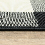 5' X 8' Black and Ivory Indoor Outdoor Area Rug