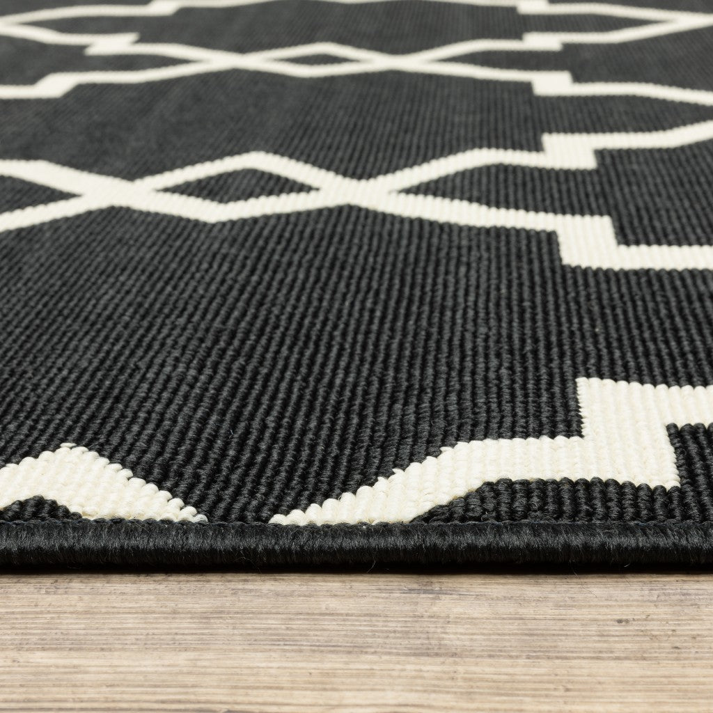 7' X 10' Black and Ivory Indoor Outdoor Area Rug