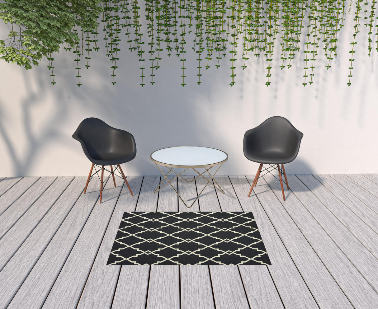 8' X 11' Black and Ivory Indoor Outdoor Area Rug