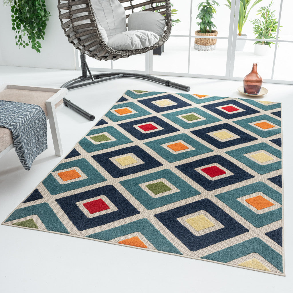 5' X 8' Blue And Ivory Geometric Stain Resistant Indoor Outdoor Area Rug