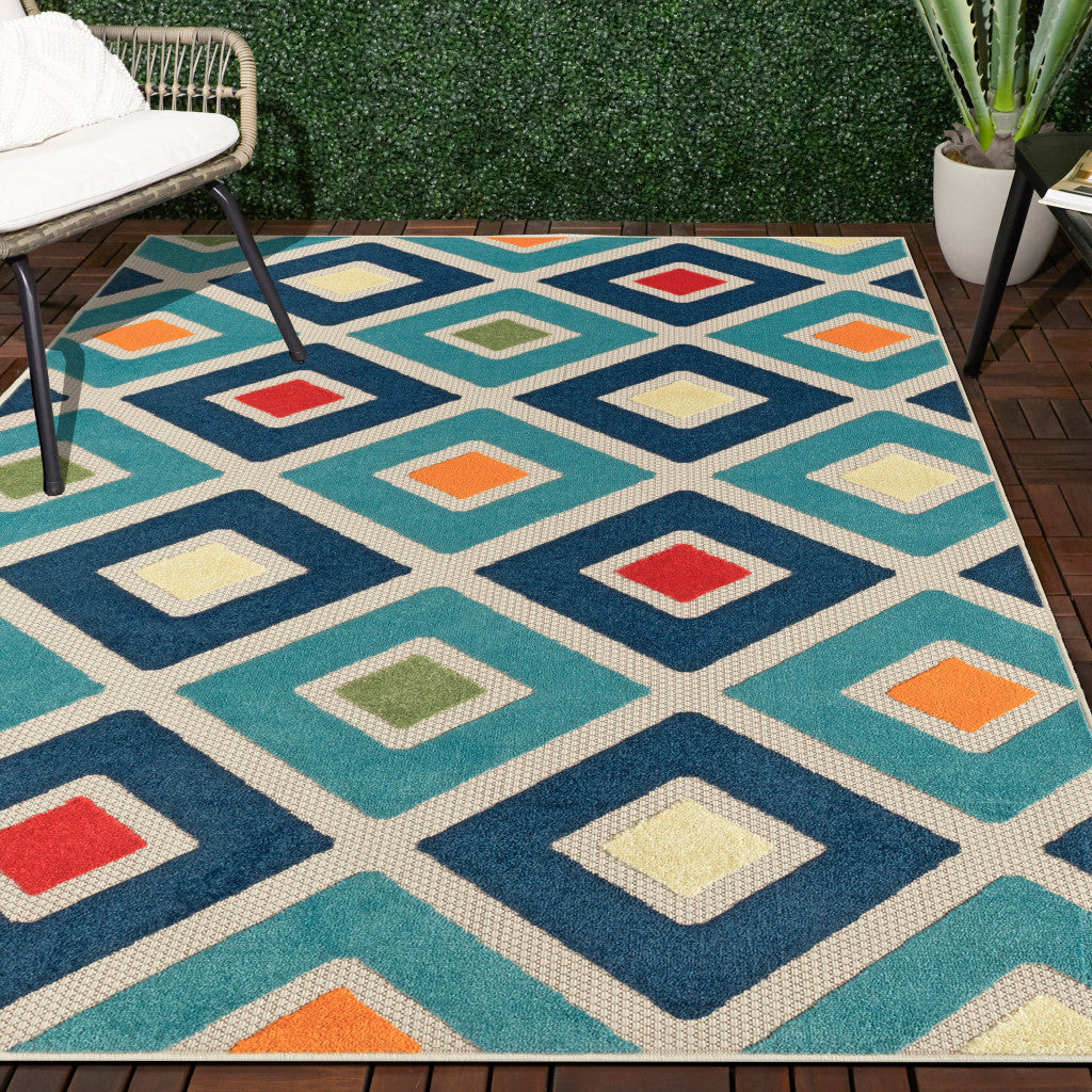 5' X 8' Blue And Ivory Geometric Stain Resistant Indoor Outdoor Area Rug