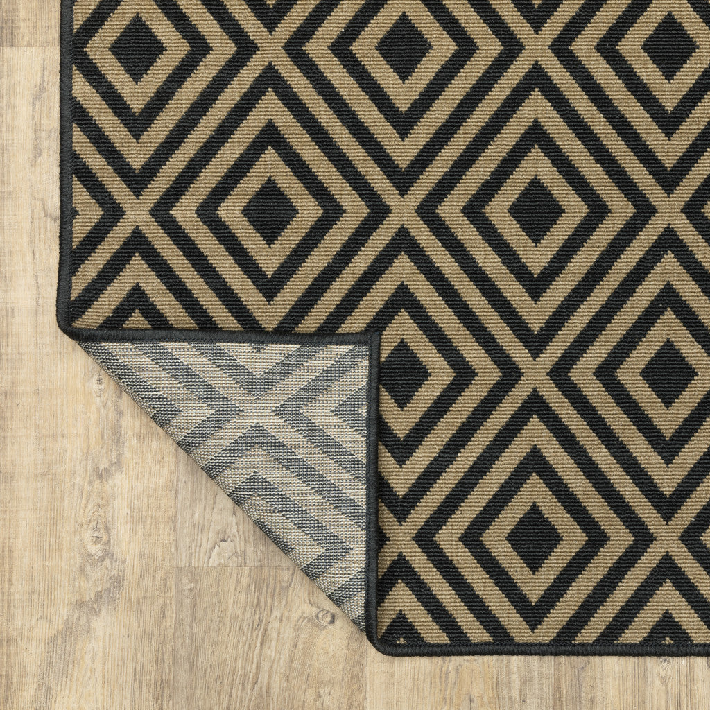 2' X 4' Black and Tan Geometric Stain Resistant Indoor Outdoor Area Rug