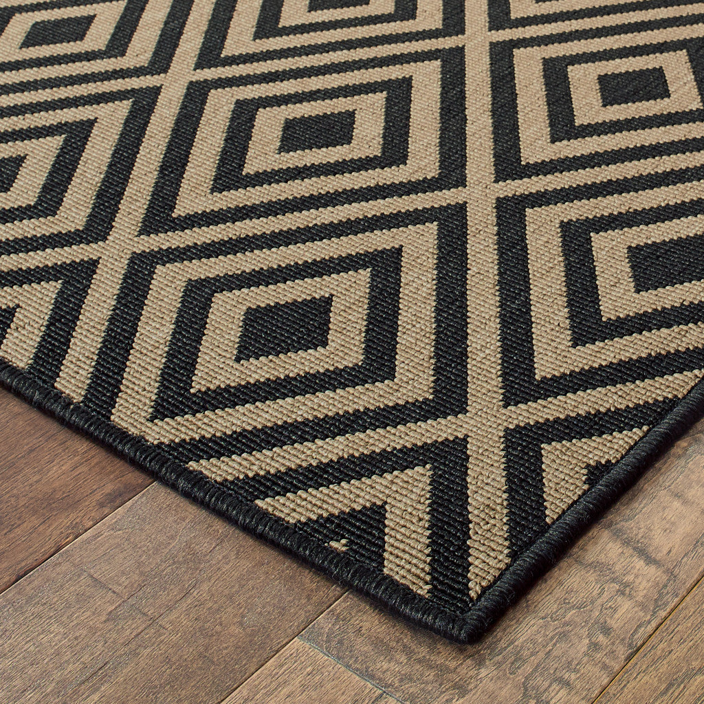 7' X 10' Black and Tan Geometric Stain Resistant Indoor Outdoor Area Rug