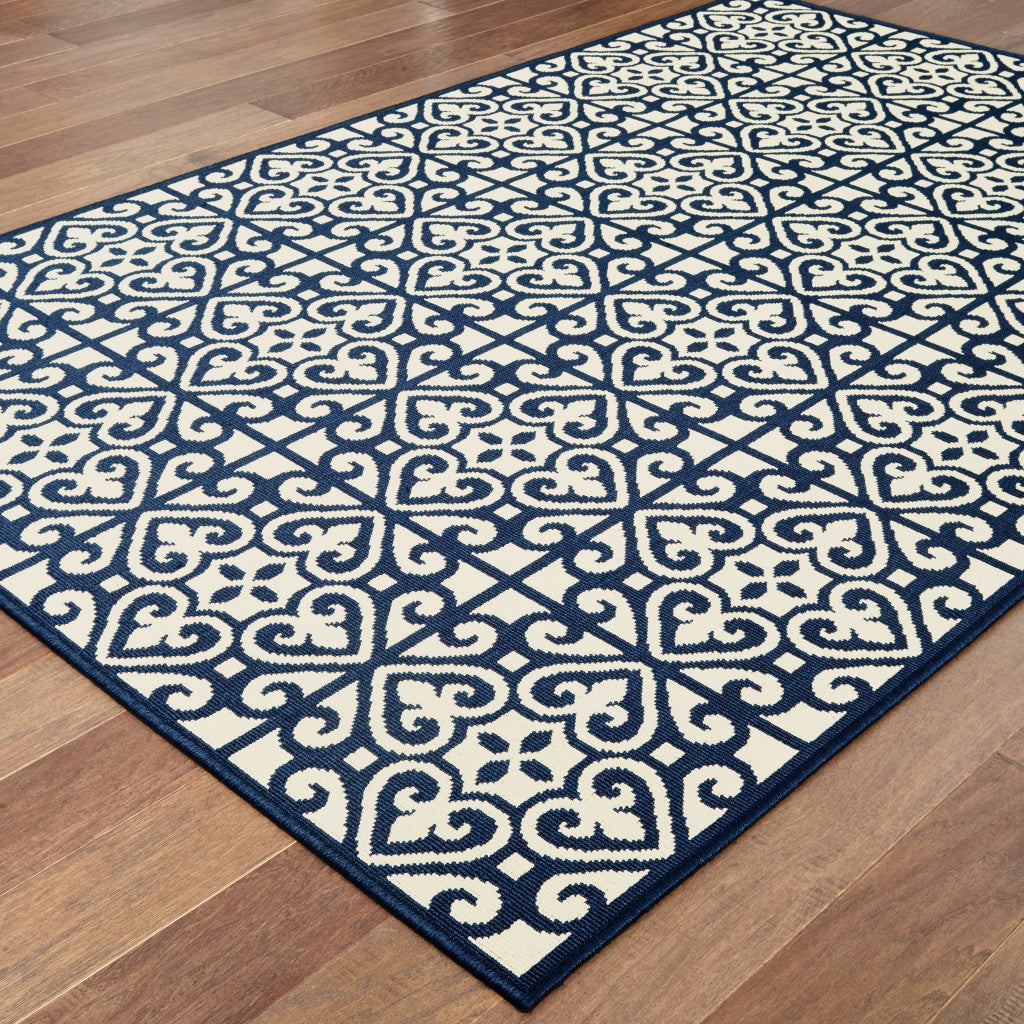 2' X 4' Ivory and Blue Geometric Stain Resistant Indoor Outdoor Area Rug