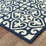 2' X 8' Ivory and Blue Geometric Stain Resistant Indoor Outdoor Area Rug