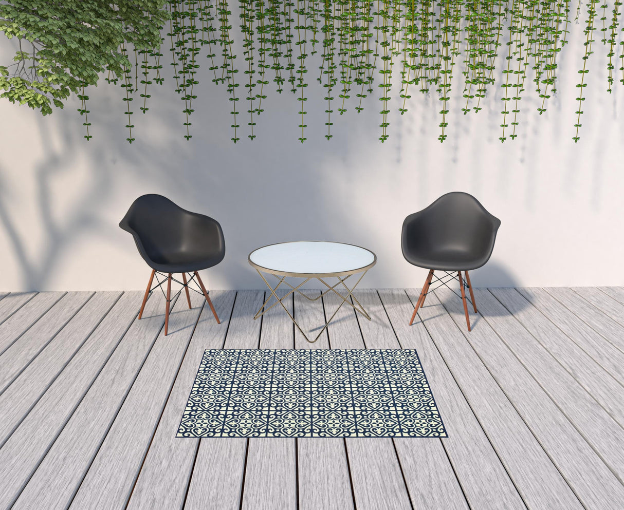 4' X 6' Ivory and Blue Geometric Stain Resistant Indoor Outdoor Area Rug