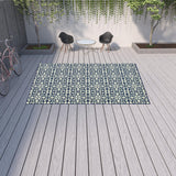 9' X 13' Ivory and Blue Geometric Stain Resistant Indoor Outdoor Area Rug