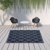 7' X 10' Blue and Ivory Geometric Stain Resistant Indoor Outdoor Area Rug