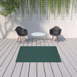 5' X 8' Blue and Green Geometric Stain Resistant Indoor Outdoor Area Rug