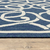 5' X 8' Blue and Ivory Geometric Stain Resistant Indoor Outdoor Area Rug