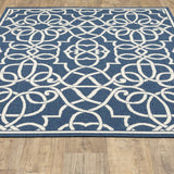 5' X 8' Blue and Ivory Geometric Stain Resistant Indoor Outdoor Area Rug