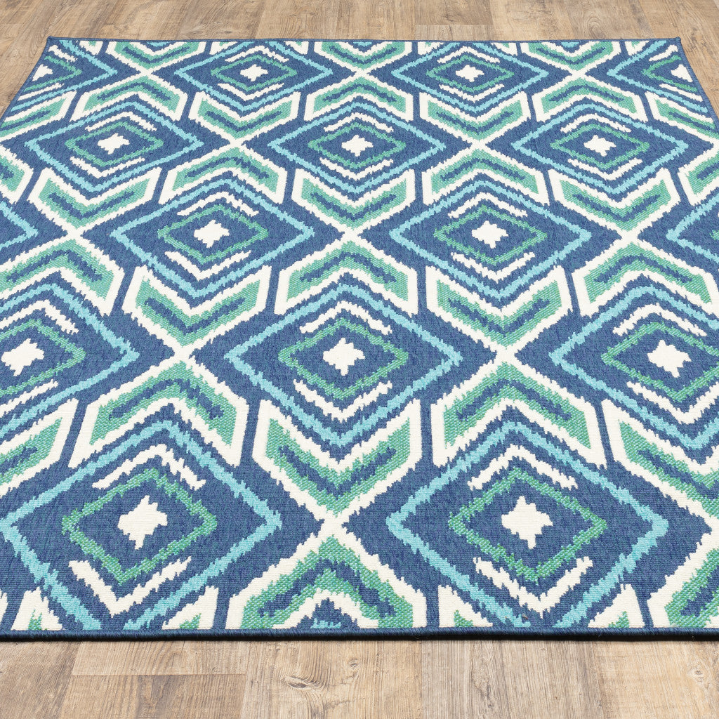 5' X 8' Blue and Ivory Geometric Stain Resistant Indoor Outdoor Area Rug