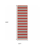 2' X 8' Red and Ivory Geometric Stain Resistant Indoor Outdoor Area Rug