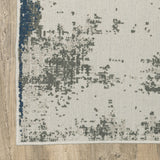 7' X 9' Blue and Beige Abstract Stain Resistant Indoor Outdoor Area Rug