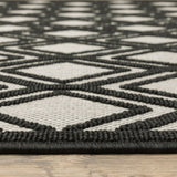 2' X 7' Beige and Black Geometric Stain Resistant Indoor Outdoor Area Rug