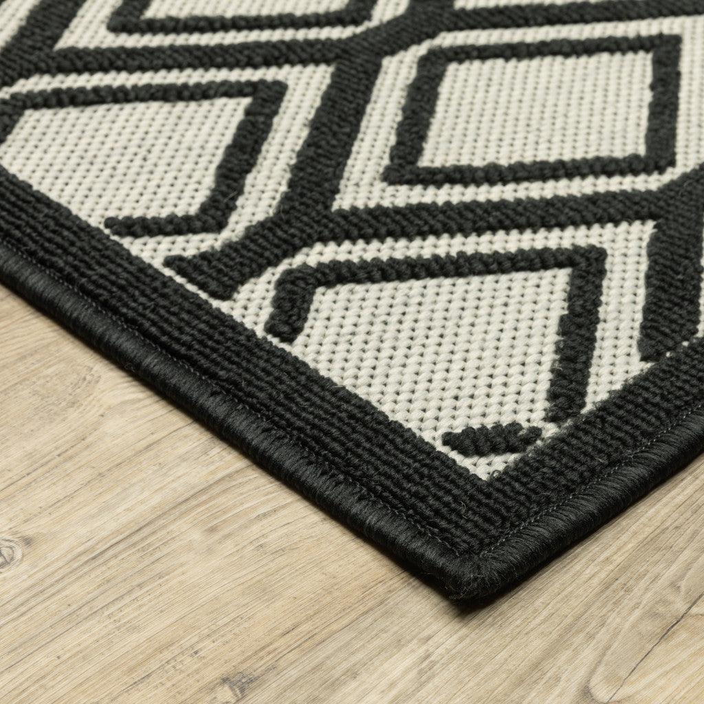 5' X 7' Beige and Black Geometric Stain Resistant Indoor Outdoor Area Rug