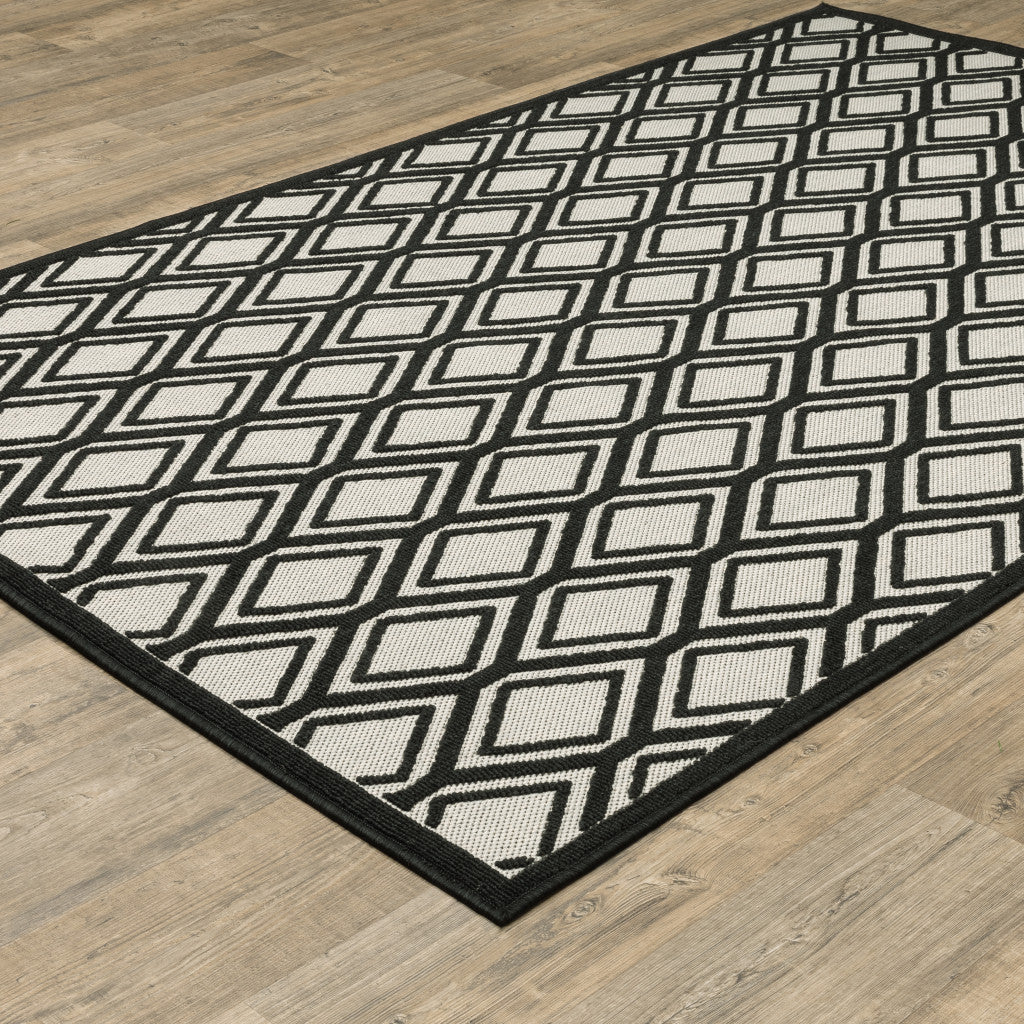 5' X 7' Beige and Black Geometric Stain Resistant Indoor Outdoor Area Rug