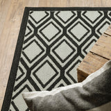 5' X 7' Beige and Black Geometric Stain Resistant Indoor Outdoor Area Rug