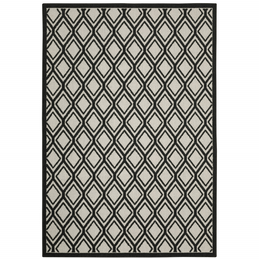 7' X 9' Beige and Black Geometric Stain Resistant Indoor Outdoor Area Rug