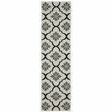 2' X 7' Beige and Black Geometric Stain Resistant Indoor Outdoor Area Rug