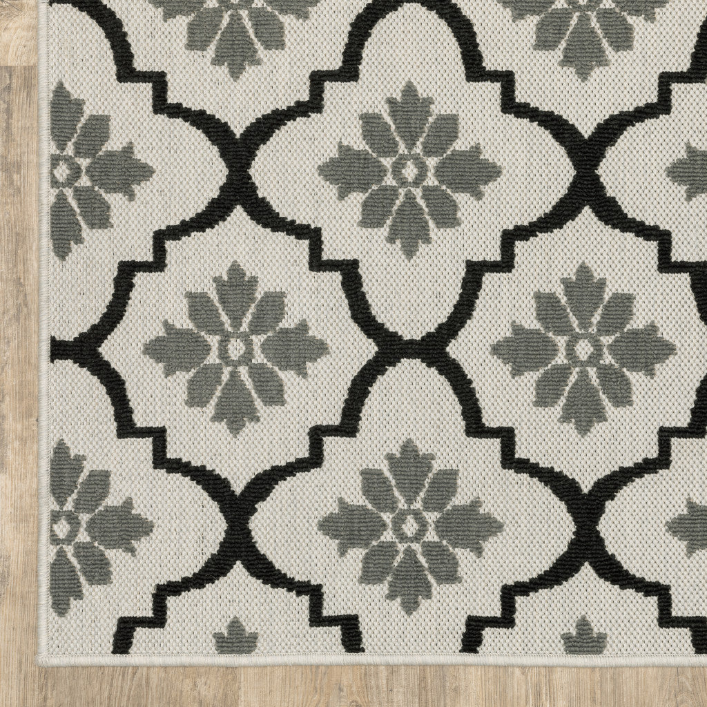 2' X 7' Beige and Black Geometric Stain Resistant Indoor Outdoor Area Rug