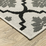 7' X 9' Beige and Black Geometric Stain Resistant Indoor Outdoor Area Rug