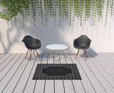 4' X 6' Black and Ivory Stain Resistant Indoor Outdoor Area Rug