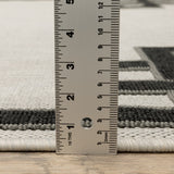 3' X 5' Beige and Black Stain Resistant Indoor Outdoor Area Rug