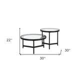 Set of Two 30" Black Glass And Steel Round Nested Coffee Tables