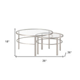 Set of Two 36" Clear and Silver Glass And Steel Round Nested Coffee Tables