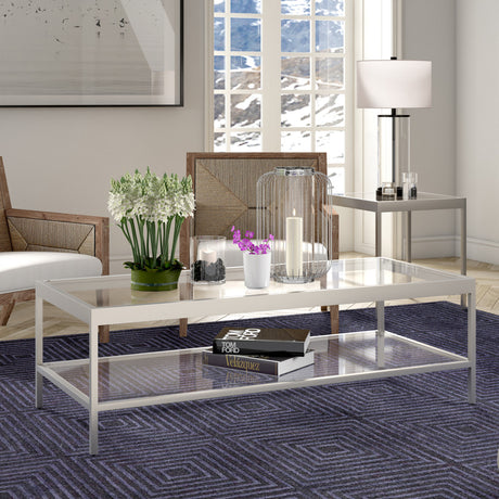 54" Clear And Silver Glass And Steel Coffee Table With Shelf