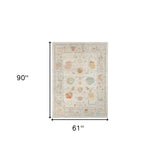 5' X 7' Gray and Orange Floral Stain Resistant Indoor Outdoor Area Rug