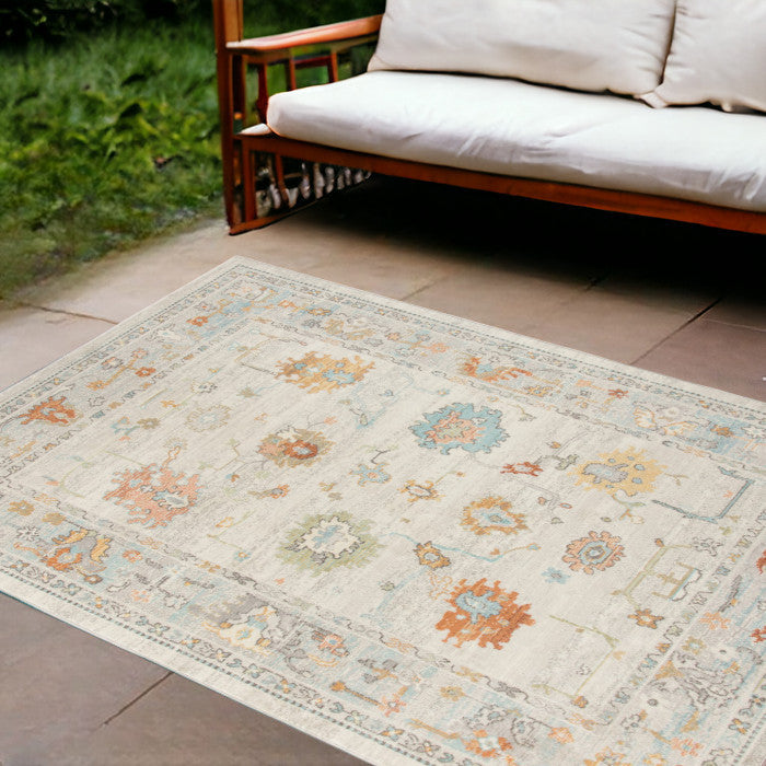 5' X 7' Gray and Orange Floral Stain Resistant Indoor Outdoor Area Rug