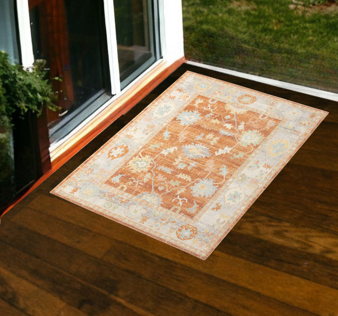 5' X 7' Blue and Orange Floral Stain Resistant Indoor Outdoor Area Rug